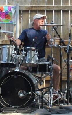 John Simpson playing drums